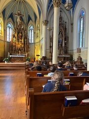 Sixth-graders at St. Peter School in Jefferson City pray for peace and contemplate the highly symbolic artwork in St. Peter Church during the Oct. 17 day of prayer and fasting for peace in the Holy Land.